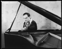 Joseph Schildkraut, actor, sitting at a piano, circa 1934