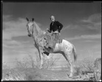 Gene Raymond, actor, riding a horse, circa 1933