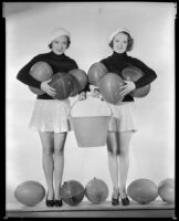 Sheila Mannors and Inez Courtney, actresses, holding balls and a bucket, circa 1934-1938