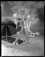 Billie Seward, actress, and another woman playing with a ball on a beach, circa 1934-1935
