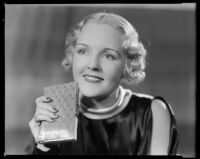 Virginia Pine, actress, holding a clutch, circa 1934-1935