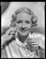 Virginia Pine, actress, applying a cosmetic product, circa 1934-1935