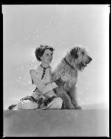 Jane Wyatt, actress, with a dog, circa 1937