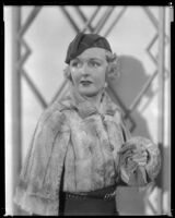 Virginia Pine, actress, modeling a fur jacket, circa 1934-1935