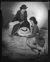 Edith Fellows, actress, with her grandmother, Elizabeth Lamb Fellows and a cake, circa 1935-1939