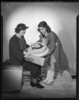 Edith Fellows, actress, with her grandmother, Elizabeth Lamb Fellows and a cake, circa 1935-1939