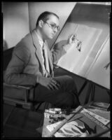 Robert Kalloch, costume designer, at his drawing table, circa 1932-1939