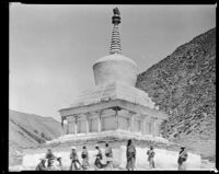 Pilgrims walking around chorten at Labrang Monastery, Xiahe Xian, 1932-1933 (Photograph used as research for Lost Horizon)