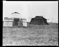 Boys standing in front of tents on the Plateau of Tibet, 1932-1933 (Photograph used as research for Lost Horizon)