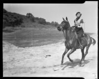 Marian Marsh, actress, riding a horse, circa 1935-1939