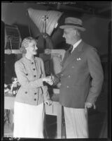 Marian Marsh, actress, shaking hands with a man, circa 1935-1939