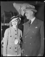 Marian Marsh, actress, standing with a man, circa 1935-1939