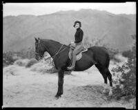 Nancy Carroll, actress, riding a horse, circa 1934-1935