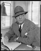 Alexander Hall, director, holding a script, circa 1938-1939