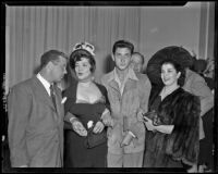 Robert Rossen, director, with actresses Fanny Schiller, a young man, and Katherine De Mille at a party for The Brave Bulls, circa 1950-1951