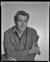 Philip Carey with revolver in hand, as Wade Harper in The Nebraskan, 1953