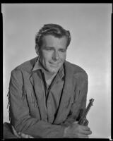 Philip Carey with revolver in hand, as Wade Harper in The Nebraskan, 1953