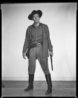 Philip Carey with rifle in hand, as Wade Harper in The Nebraskan, 1953