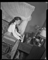 Susan Peters, actress, playing the piano, circa 1947-1948