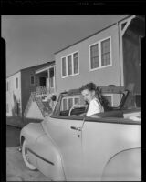 Susan Peters, actress, seated in her car, circa 1947-1948