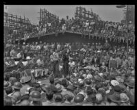 Nan Wynn entertains a crowd in a shipyard in Good Luck, Mr. Yates, 1943