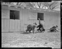 Men on the ground during a fight in an unidentified film, 1940s or 1950s