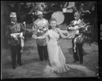 Janet Blair dancing and singing in front of three musicians in Two Yanks in Trinidad, 1941