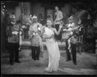 Janet Blair dancing and singing in front of a band in Two Yanks in Trinidad, 1941