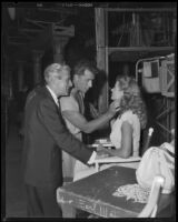 Buddy Adler, producer, with Stewart Granger and Rita Hayworth on the set of Salome, 1952