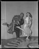 Charles Laughton and Rita Hayworth on the set of Salome, 1952