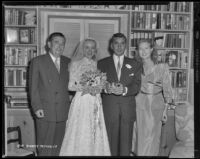 Audrey Totter, actress, with Dr. Leo Fred and two others on their wedding day, 1952