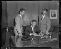 Frank “Boley” Dancewicz, football player, and two Columbia Pictures executives, circa 1948