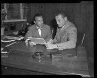 Harry E. Weiner, Columbia Pictures executive, and football player Steve Van Buren, circa 1948