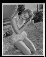 Constance Towers, actress, fixing her hair, copy print, circa 1955