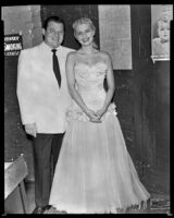 Constance Towers, singer and actress, with actor and comedian Jack Carson, backstage during a performance, circa 1953-1955