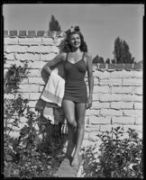 Rita Hayworth, actress, modeling a bathing suit, circa 1940-1949