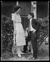 Consuelo Flowerton, actress and singer, conversing with a man, copyprint, early 1920s