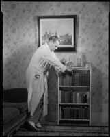 Jack Holt, actor, at home in robe and pajamas, Santa Monica, 1934