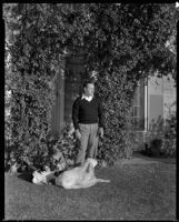 Jack Holt, actor, in his yard with his dog, Santa Monica, 1934