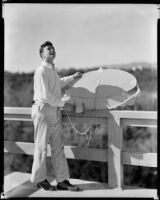 Tim Holt, actor, as a teenager at home with a kite, Santa Monica, circa 1934