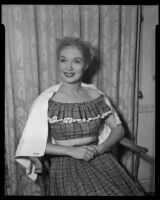 Gloria Henry, actress, receiving a hair treatment, circa 1947-1951