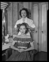 Gloria Henry, actress, and a beautician, circa 1947-1951