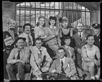 Alexander Hall, director, seated at center, and cast members of My Sister Eileen, [copy print?], 1942