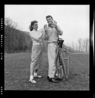 Maureen O’Hara and Patrick Wayne on a golf course around the time they were filming The Long Gray Line, 1954