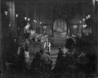 Cast and crew members filming a chapel scene for The Long Gray Line, 1954