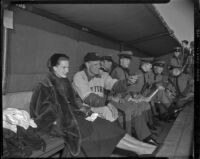 Maureen O’Hara in a dugout with military cadets and a man in a New York Yankees uniform, during production of The Long Gray Line, 1954