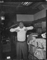 William Leslie, actor, souvenir shopping while on location at West Point for The Long Gray Line, 1954