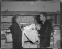 William Leslie and Robert Francis souvenir shopping while on location at West Point for The Long Gray Line, 1954