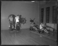 Robert Francis, Patrick Wayne, William Leslie and Philip Carey, exercising in a gym during production of The Long Gray Line, 1954