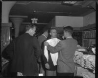 Robert Francis, William Leslie, Patrick Wayne and Philip Carey, souvenir shopping while on location at West Point for The Long Gray Line, 1954